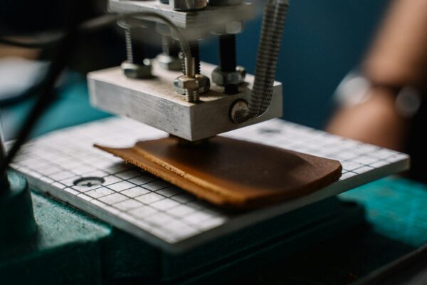 Close-Up Shot of a Person Making Leather