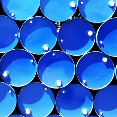 High Angle Photograph of Blue Metal Barrels